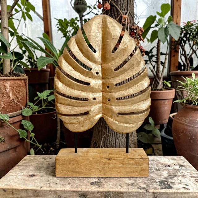 Elevate your home decor with the Carved Wood Monstera Leaf Sculpture, a stunning piece that combines natural beauty with...