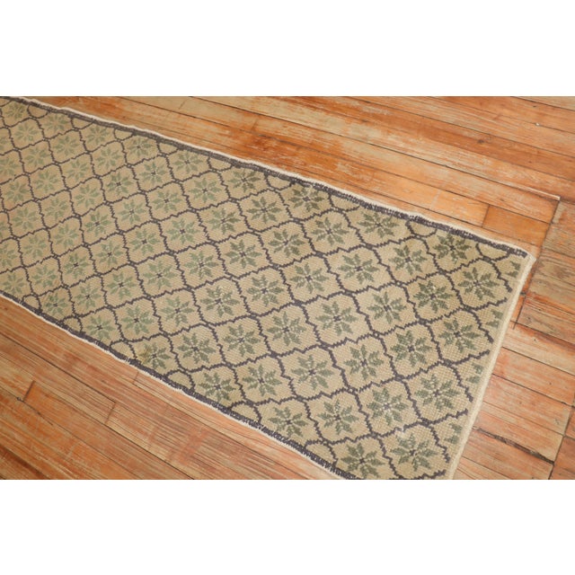One-of-a-kind decorative Vintage Turkish Konya runner with a repetitive borderless motif in earth tones Measures: 1'11'' x...
