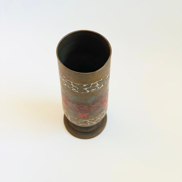 A vintage brass vase with a lovely etched floral design to the surface. Various pigments have been pressed into areas of...
