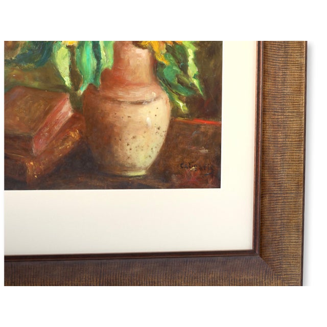 A vibrant still life oil on board featuring a bouquet of sunflowers in full bloom, nestled in an earthy-toned vase beside...