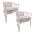 A beautiful pair of vintage barrel lounge chairs. Featuring gracefully curved frames with handwoven cane side and back...
