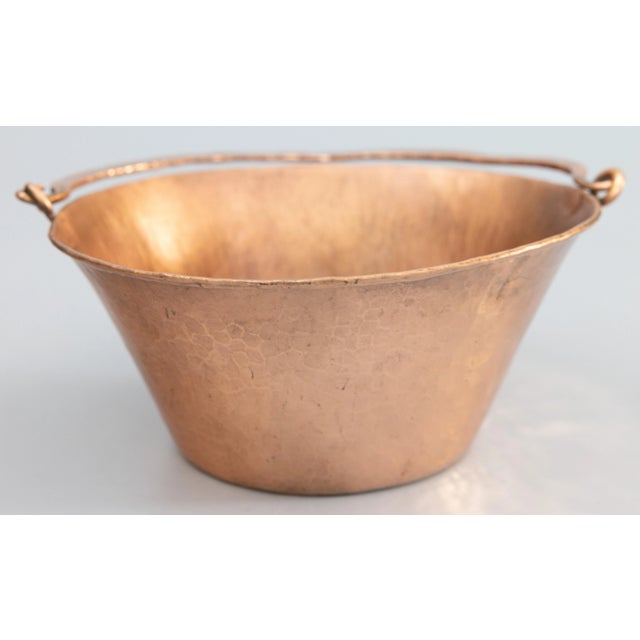 A gorgeous antique hand-hammered petite French copper planter or hanging basket with a swing handle and a lovely patina....