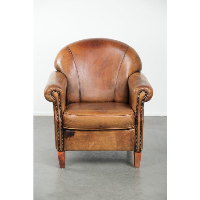 A characterful sheepskin armchair with a beautiful vintage look and a finish with decorative nails. : This is a great...