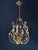 The chandelier is crafted in the florentine style. Material: coated iron – exquisite artistic wrought ironwork. Decorated...