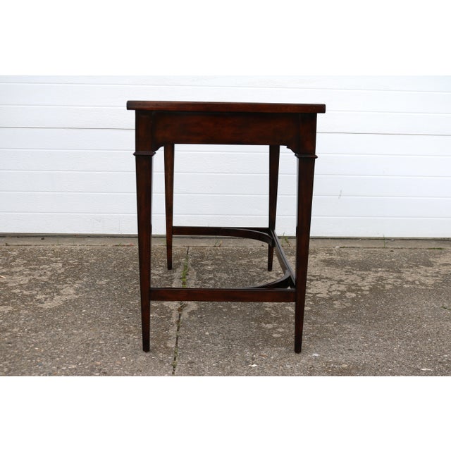 Very nice petite desk with two shallow drawers from Woodbridge. This desk has a distressed rail running the perimeter of...