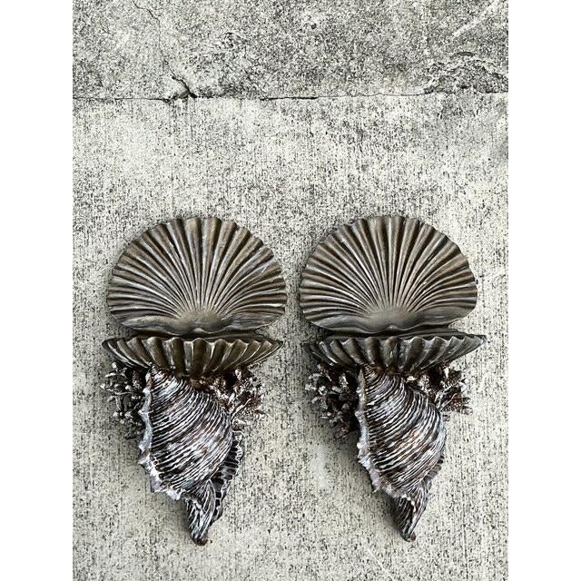 This stunning pair of vintage wall brackets serves as a theatrical celebration of maritime luxury, perfectly capturing the...