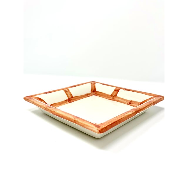 A ceramic tray hand-painted in Italy to resemble woven bamboo fretwork, with visible brushstrokes rather than a printed...