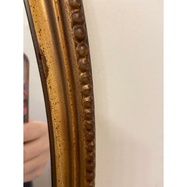 Early 21st Century Filigree Ornate Gilded Beveled Gold Bow Oval Wall