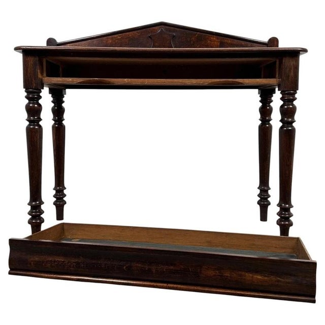 A handsome 19th-century English side table, finely crafted from oak and distinguished by its generous proportions, elegant...