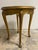 This enchanting "imperial" coffee table features a round top and finely carved legs, embellished with a golden finish that...