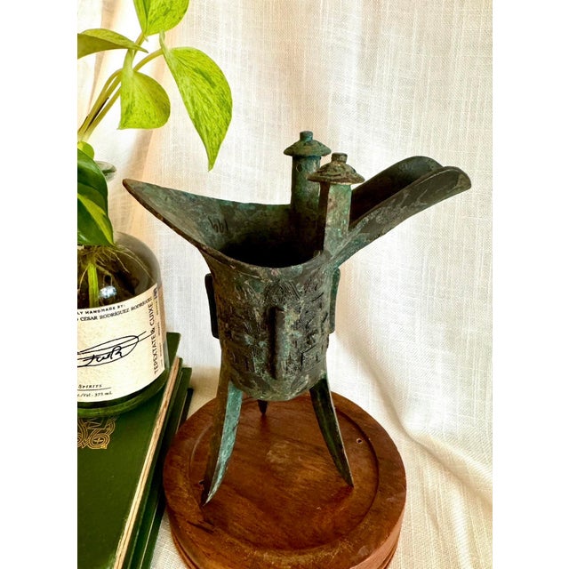 Archaic-style Chinese bronze Jue wine vessel, cast in solid bronze and finished with a richly layered verdigris patina....