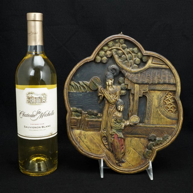 A decorative wood plaque with a subdued pallet. There is much handwork and it has a folksy quality. The deeply carved soft...