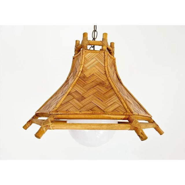 Light and airy mid century pendant light featuring natural woven chevron wicker panels set into a hexagonal bamboo frame...