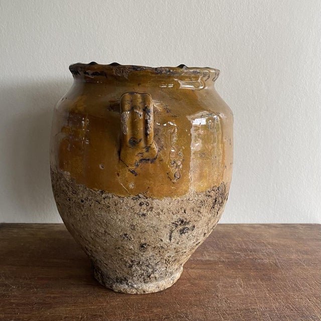 Antique yellow glazed grease pot. These pots were once used for preserving food and are now perfect for decoration,...