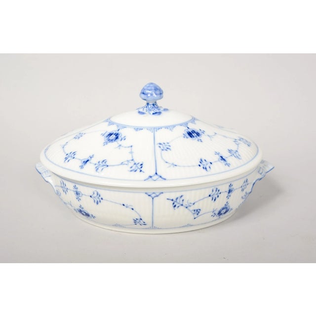 Elevate your table setting with this elegant Royal Copenhagen Blue Fluted Plain covered tureen, a timeless piece of fine...