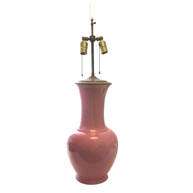 A beautiful and elegant mid century Chinese style table lamp in a soft pink glaze, embodying the glamour and...