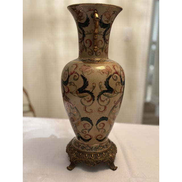 Offered is a traditional decorative vase with chinoiserie theme details. This piece has one previous owner and well cared...