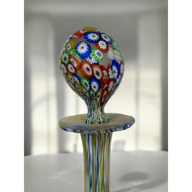 A Lot of 2 Italian Fratelli Toso Millefiori Glass Bottles with stoppers. The Millefiori glass gives a multicolored look...
