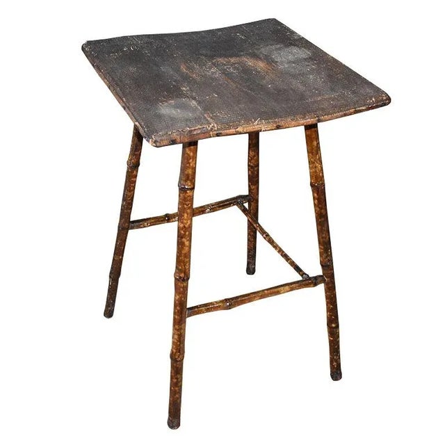 A very old, antique burnt bamboo side table. This side table or accent table is made of a combination of wood and burnt...