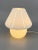 * A table lamp / mushroom lamp * Made entirely of Murano glass * White * with a pattern in the material * Manufacturer:...