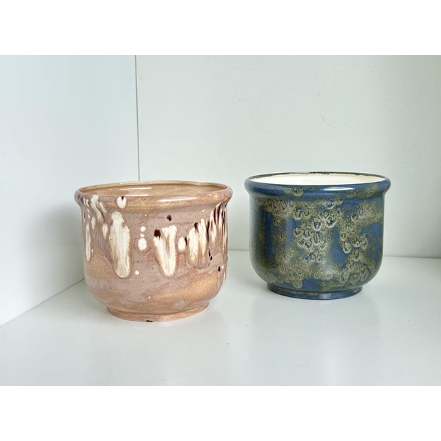 This pair of handcrafted, individually designed ceramic plant pots comes from a small, unknown German ceramics workshop...