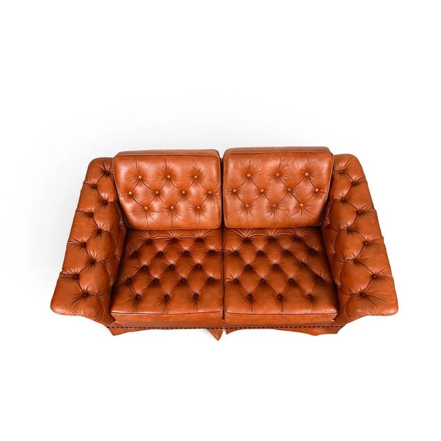 A mid century Danish chesterfield type tufted leather loveseat / sofa. Solid construction and quality leather, coupled...