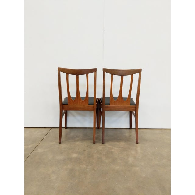 Pair of authentic vintage mid century modern dining chairs. "Brasilia" series by G Plan. Maker's label on bottoms. This...