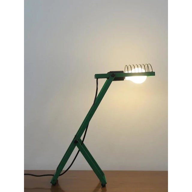 Italian adjustable table lamp Sintesi model designed by Ernesto Gismondi for Artemide. Painted metal structure, 1970s...