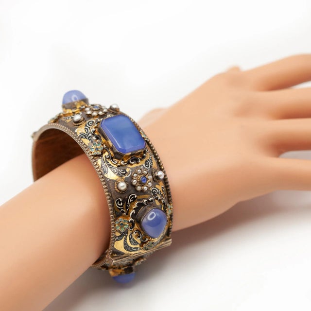 A magnificent example of Austro-Hungarian craftsmanship, this rare antique silver vermeil bracelet from 1900s. The wide...