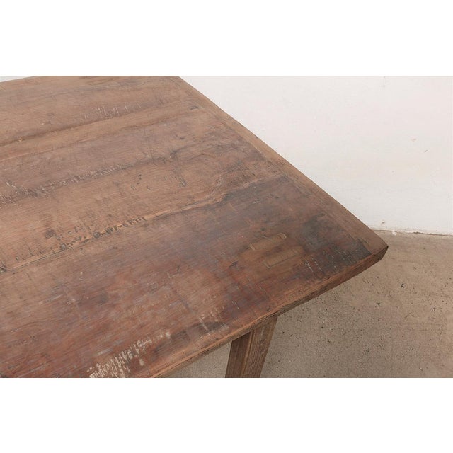 This dining table pairs an original vintage elm top — showcasing decades of natural grain, knots, and surface character —...