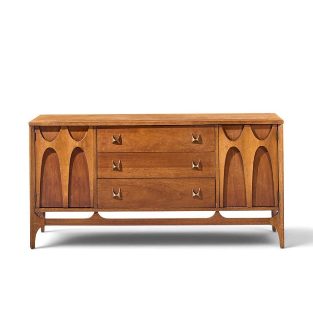 Broyhill Brasilia Mid Century Walnut and Brass Credenza This credenza measures: 56 wide x 17 deep x 28 inches high Fair...