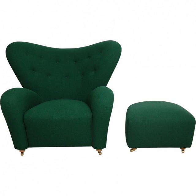 Fleming Lassen's "The Tired Man" lounge chair with ottoman, fully upholstered in green Hallingdal fabric, and with legs of...