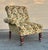 Vintage English Victorian Style Slipper Chair with one arm in floral fabric with mahogany legs and brass casters.