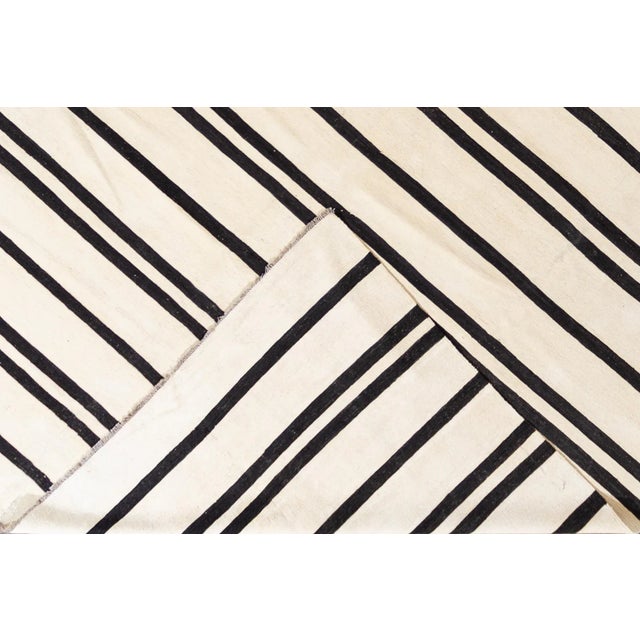 Beautiful 21st century contemporary Kilim Rug, handwoven wool in an all-over black and white striped design. This rug...