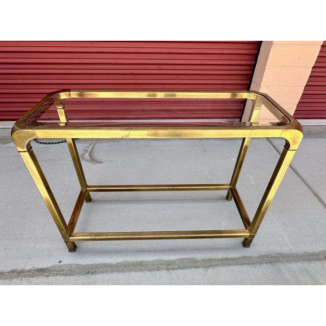 Vintage Mastercraft Style Brass & Glass top console table. Perfect for a small entry way. No markings sourced from an...