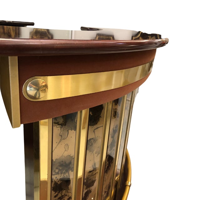 A semicircular bar in the Art Deco revival style, produced approximately between the 1960s and 1970s. Made of varnished...