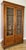 An elegant Antique French bookcase in walnut, featuring tall glazed double doors, a warm polished finish and a refined...