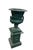 A vintage cast iron garden urn presented on its matching square pedestal, exemplifying classic Neoclassical design....