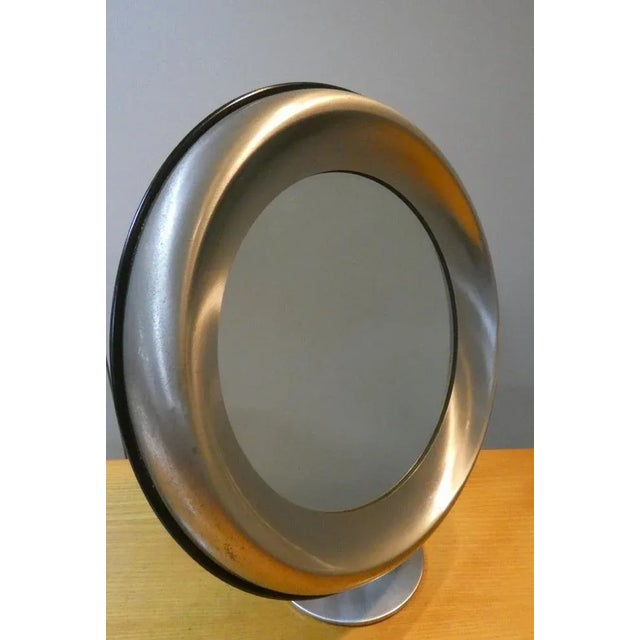 Large table mirror in satin steel, designed by Gaetano Missaglia in the 60s. Impactful decorative element, created in...