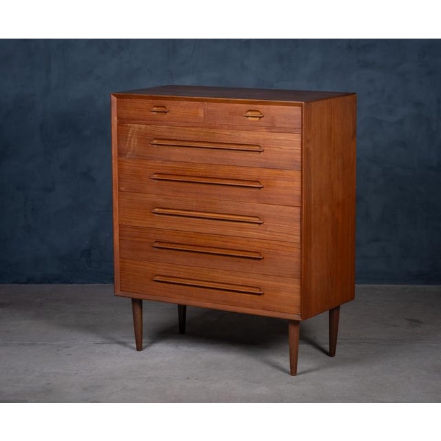Elegant 7-drawer chest in teak, designed by Ejvind A. Johansson and produced by Gern Møbelfabrik in the 1960s. Featuring...
