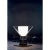 Table lamp of clear mouth blown Murano glass, anthracite painted iron and natural brass designed in 1984 by Carlo Moretti...