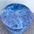 Striking Postmodern cylindrical pedestal featuring a dramatic faux blue marble finish with rich navy, cobalt, gray, and...