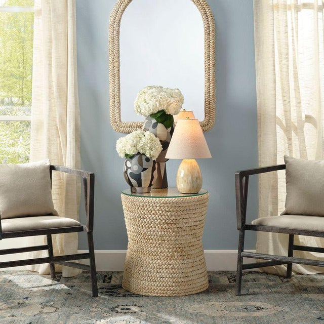 Elegantly wrapped in rows of braided corn husk, this small side table features a sturdy tempered glass top, making it a...