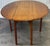Beautiful English style gateleg table by Wright table company. Features a yew wood top with drop leaves, square legs and...