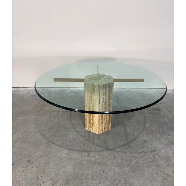 Solid marble base with gold cross supports and a wide, thick glass top. Can sit 6 comfortably and is in excellent shape...