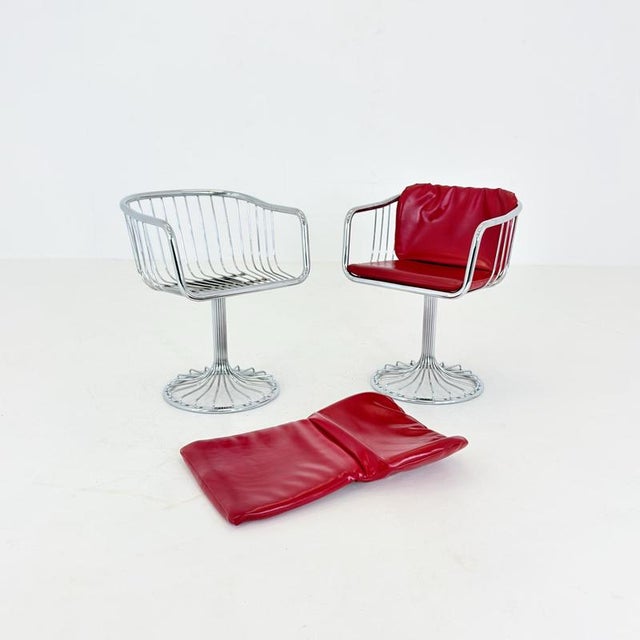 Mid-century cantilever armchairs by gastone rinaldi for rima, italy, 1970s a striking pair of mid-century modern...
