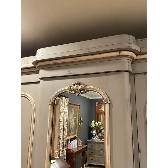 If you need storage, this is the piece for you! Painted in a Parisian Gray With Cream and gold accents. Original mirror....