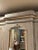 If you need storage, this is the piece for you! Painted in a Parisian Gray With Cream and gold accents. Original mirror....