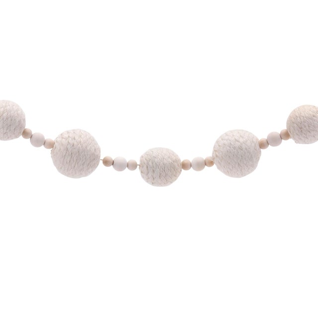 Add a cozy, rustic touch to your holiday decor with this Fabric Ball String Garland. Featuring a beautiful combination of...