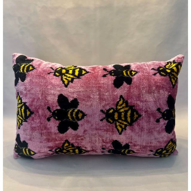 The Silk Velvet Lumbar Bee Patterned Pillow w/ Insert (16” x 24”) blends elegance with comfort. Handmade in Turkey and...